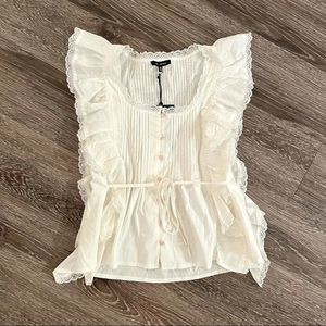 En saison sleeveless ruffle blouse nwot